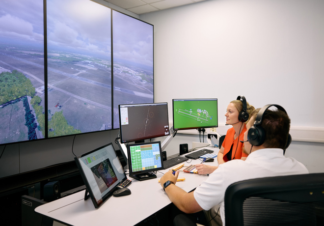 Air Traffic Services professionals training on a simulator